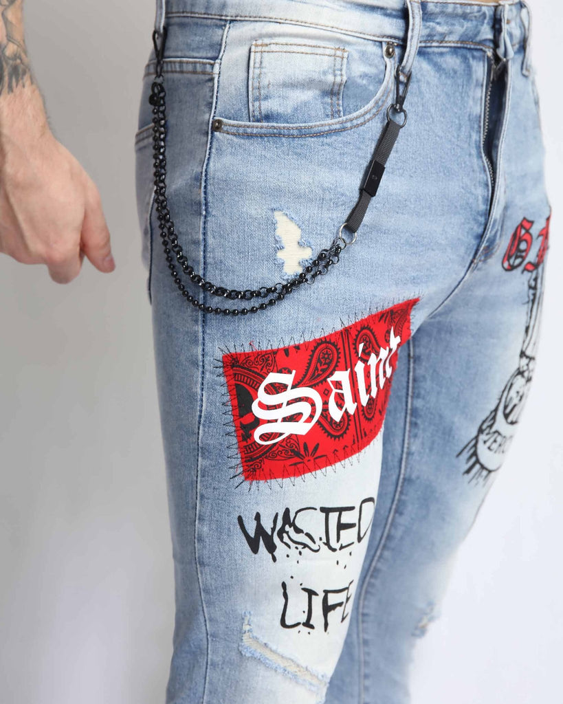 Graffiti Ripped Blue Jeans with Red Patches and Cashew Flower Elements - WorkPlayTravel Store